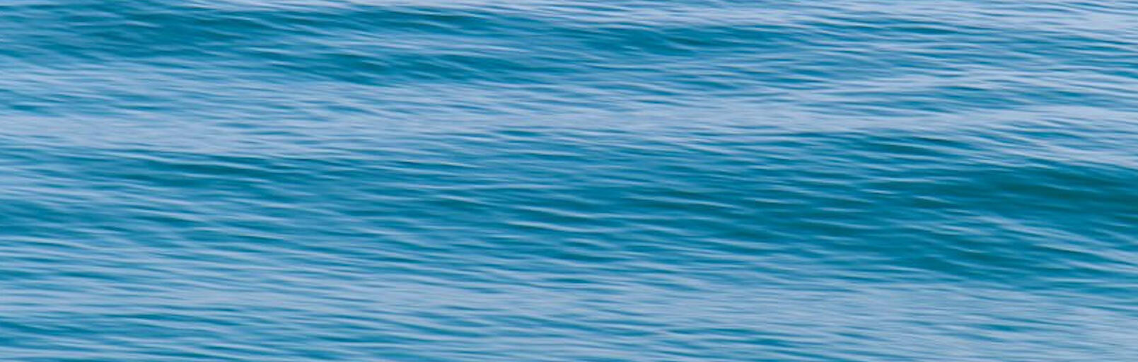 Waters Edge Waves close up of gentle blue ocean waves