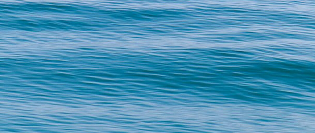 The Waters Edge Ocean horizon photo with varying shades of blue and teal